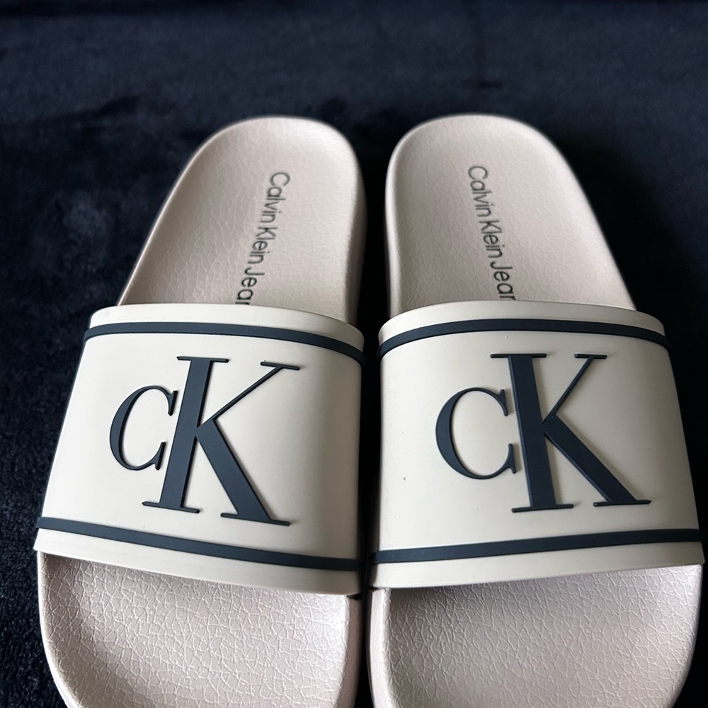 Calvin Klein Jeans Cream Slide Sandals with Black CK Logo